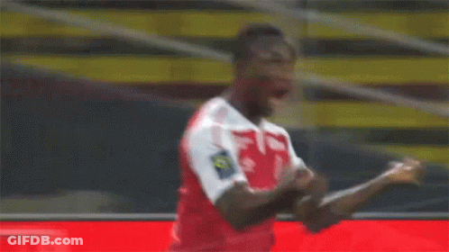 A Soccer Player Wearing A Red Shirt With The Number 10 On The Back GIF