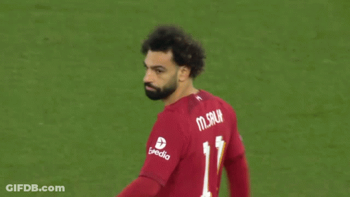 A Soccer Player Wearing A Red Shirt With The Number 11 On The Back GIF