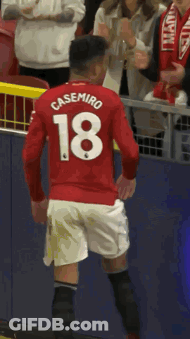 A Soccer Player Wearing A Red Shirt With The Number 18 On It GIF