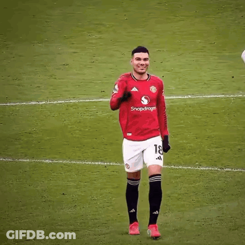 A Soccer Player Wearing A Red Shirt With The Number 7 On It GIF