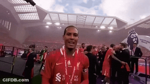 A Soccer Player Wearing A Red Shirt With The Word Liverpool On It GIF