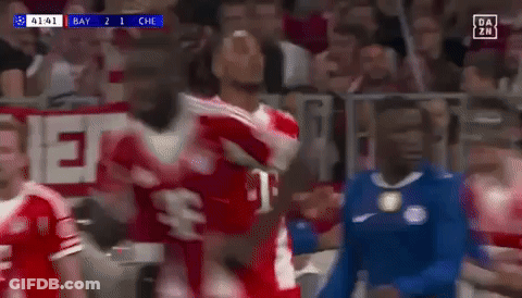A Soccer Player Wearing A Red T-Mobile Jersey Is Celebrating A Goal GIF