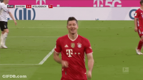 A Soccer Player Wearing A Red T-Mobile Jersey Is Smiling GIF