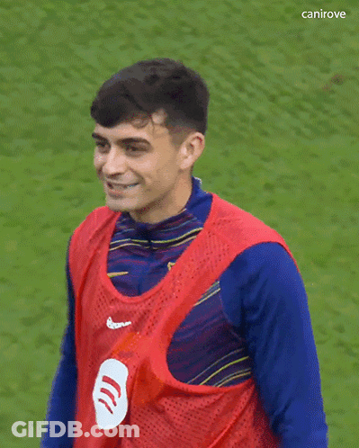 A Soccer Player Wearing A Red Vest With Spotify On It GIF