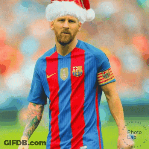 A Soccer Player Wearing A Santa Hat And A Fc Barcelona Shirt GIF