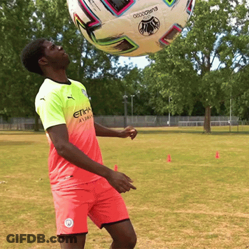 A Soccer Player Wearing A Shirt That Says Etihad Airways Kicks A Soccer Ball GIF