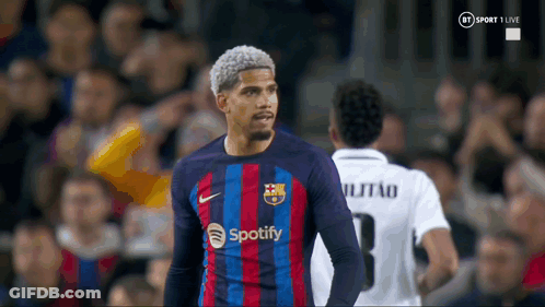 A Soccer Player Wearing A Spotify Jersey Stands In Front Of A Crowd GIF