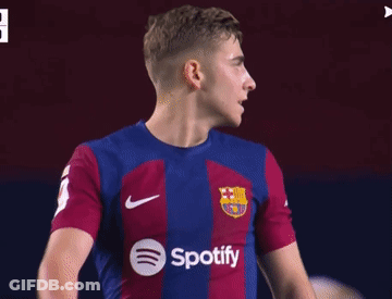 A Soccer Player Wearing A Spotify Shirt Looks To His Left GIF