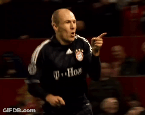 A Soccer Player Wearing A T-Mobile Jersey Is Celebrating A Goal During A Game . GIF