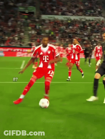 A Soccer Player Wearing A T-Mobile Jersey Is Kicking The Ball GIF