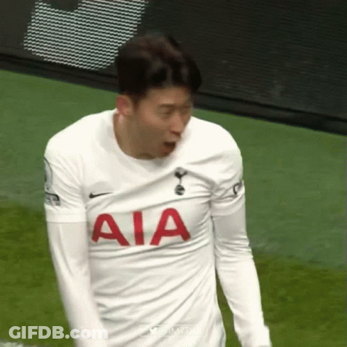 A Soccer Player Wearing A White Aia Jersey Is Standing On The Field . GIF
