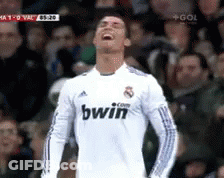 A Soccer Player Wearing A White Bwin Jersey Is Laughing GIF