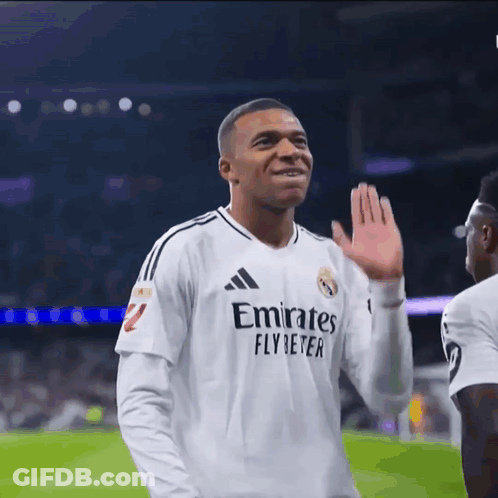 A Soccer Player Wearing A White Emirates Fly Beter Jersey GIF