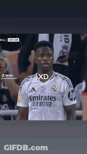 A Soccer Player Wearing A White Emirates Fly Better Jersey GIF