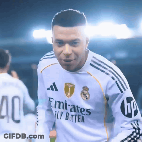 A Soccer Player Wearing A White Emirates Fly Bitter Jersey GIF