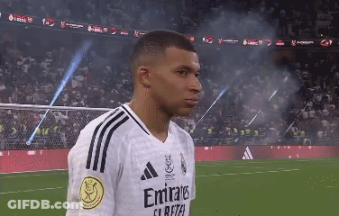 A Soccer Player Wearing A White Emirates Jersey GIF