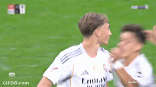 A Soccer Player Wearing A White Emirates Shirt GIF