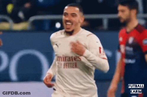 A Soccer Player Wearing A White Jersey That Says Emirates Fly Better GIF