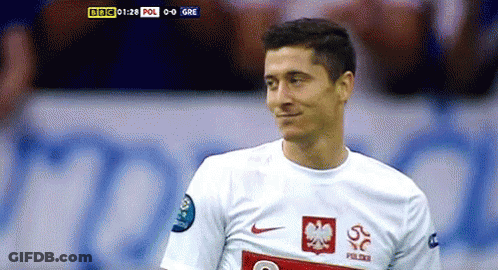 A Soccer Player Wearing A White Jersey With A Red Eagle On The Front GIF