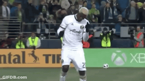A Soccer Player Wearing A White Jersey With Alaska On The Front GIF