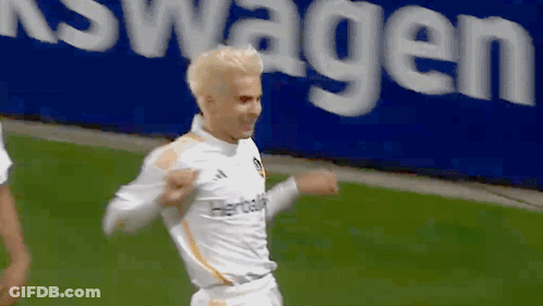 A Soccer Player Wearing A White Jersey With Herbalife On It GIF
