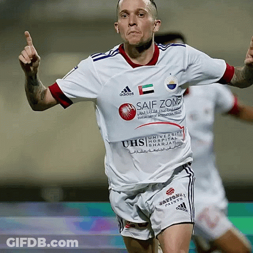 A Soccer Player Wearing A White Jersey With Safe Zone Written On It GIF