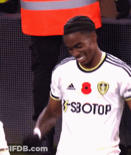 A Soccer Player Wearing A White Jersey With Sbotop Written On It GIF