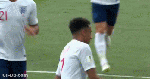 A Soccer Player Wearing A White Jersey With The Number 1 On It Is Standing On A Soccer Field . GIF