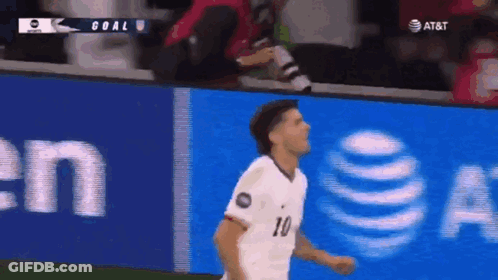 A Soccer Player Wearing A White Jersey With The Number 10 On It GIF