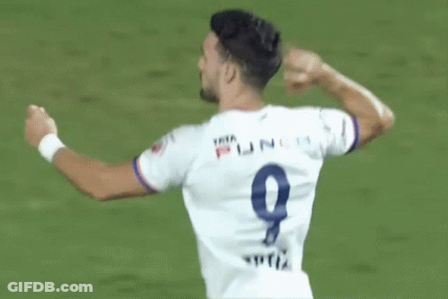 A Soccer Player Wearing A White Jersey With The Number 9 On The Back GIF