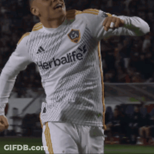 A Soccer Player Wearing A White Jersey With The Word Herbalife On It GIF