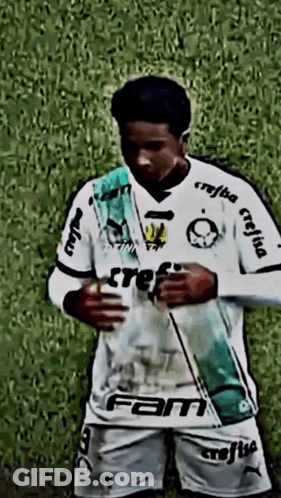 A Soccer Player Wearing A White Shirt That Says Fam GIF