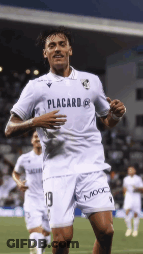 A Soccer Player Wearing A White Shirt That Says Placard On It GIF