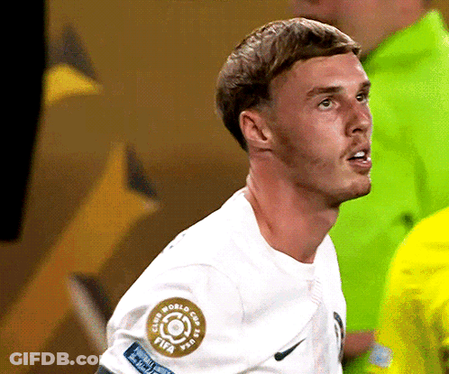 A Soccer Player Wearing A White Shirt With A Fifa Logo On His Sleeve GIF