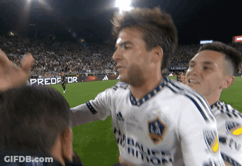 A Soccer Player Wearing A White Shirt With A Galaxy Logo On It GIF