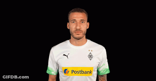 A Soccer Player Wearing A White Shirt With A Postbank Logo On It GIF
