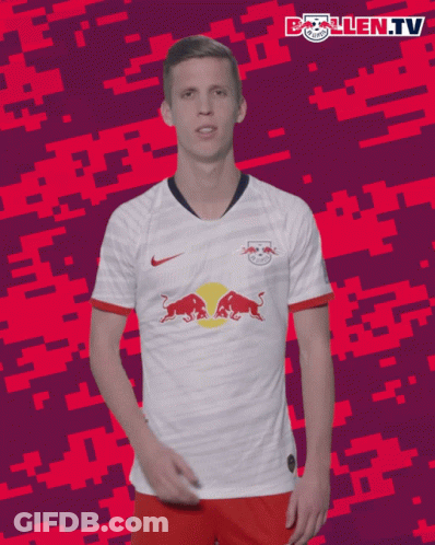 A Soccer Player Wearing A White Shirt With A Red Bull On It GIF