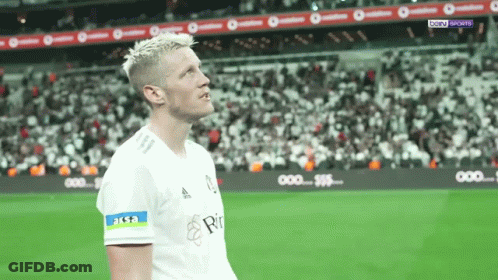 A Soccer Player Wearing A White Shirt With The Word Aksa On His Sleeve GIF