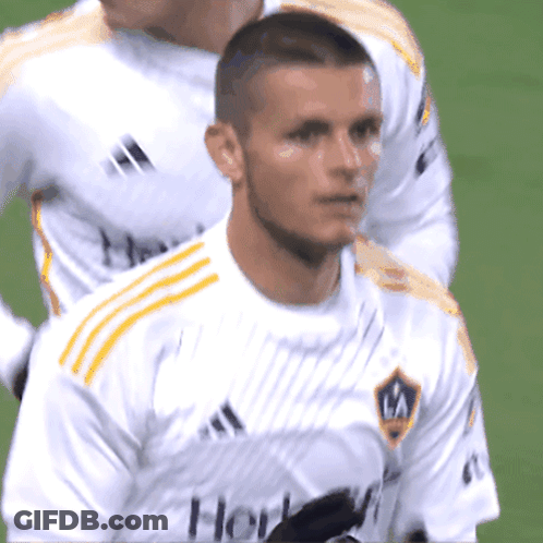 A Soccer Player Wearing A White Shirt With The Word Galaxy On It GIF
