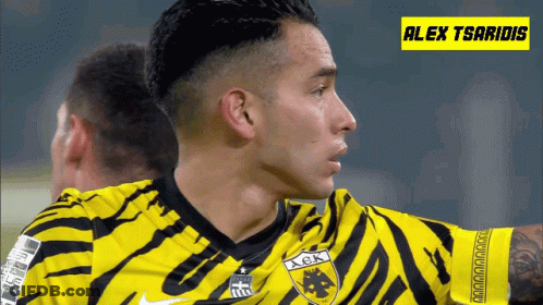 A Soccer Player Wearing A Yellow And Black Jersey With The Name Alex Tsaridis GIF