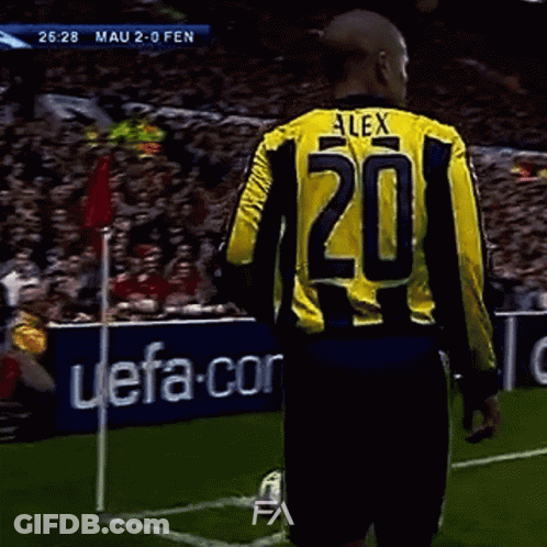A Soccer Player Wearing A Yellow And Black Jersey With The Number 20 On It GIF