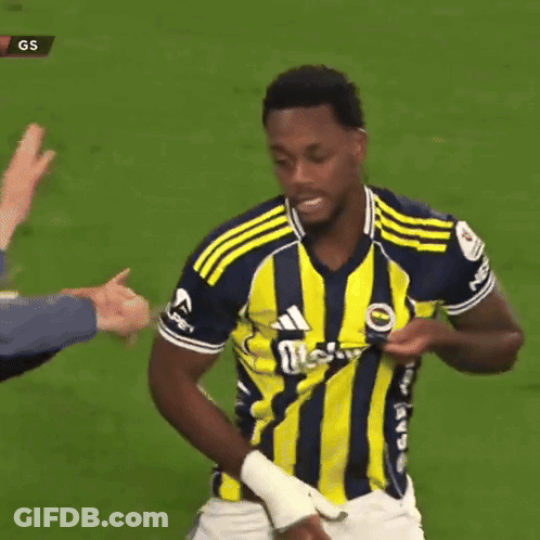 A Soccer Player Wearing A Yellow And Blue Jersey That Says Adidas GIF