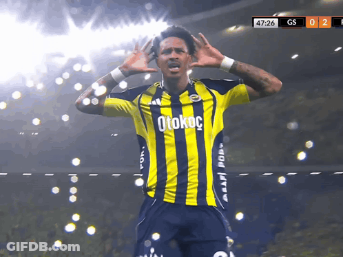 A Soccer Player Wearing A Yellow And Blue Striped Jersey With Otokoc On It GIF