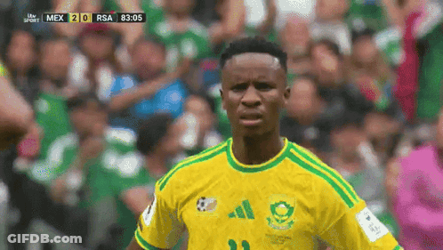 A Soccer Player Wearing A Yellow And Green Jersey With The Number 21 On It GIF