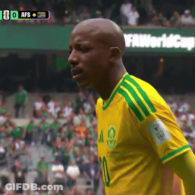 A Soccer Player Wearing A Yellow And Green Shirt With The Number 10 On It GIF
