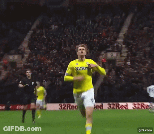 A Soccer Player Wearing A Yellow Jersey That Says 32Red On It GIF