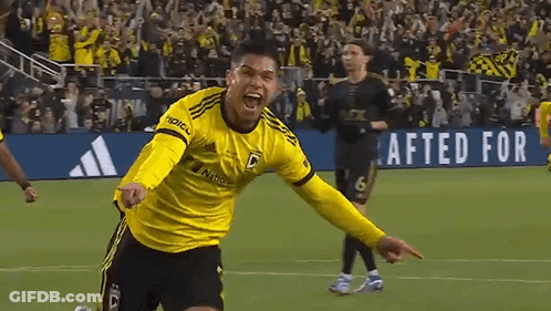 A Soccer Player Wearing A Yellow Jersey That Says Adidas On It GIF