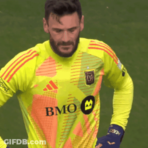 A Soccer Player Wearing A Yellow Jersey With Bmo On The Front GIF