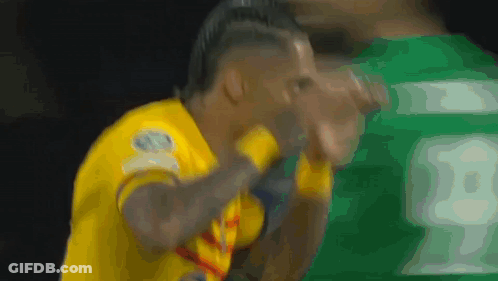 A Soccer Player Wearing A Yellow Jersey With The Number 18 On It GIF