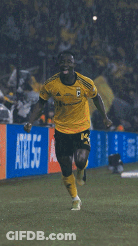 A Soccer Player Wearing A Yellow Jersey With The Number 34 On It GIF